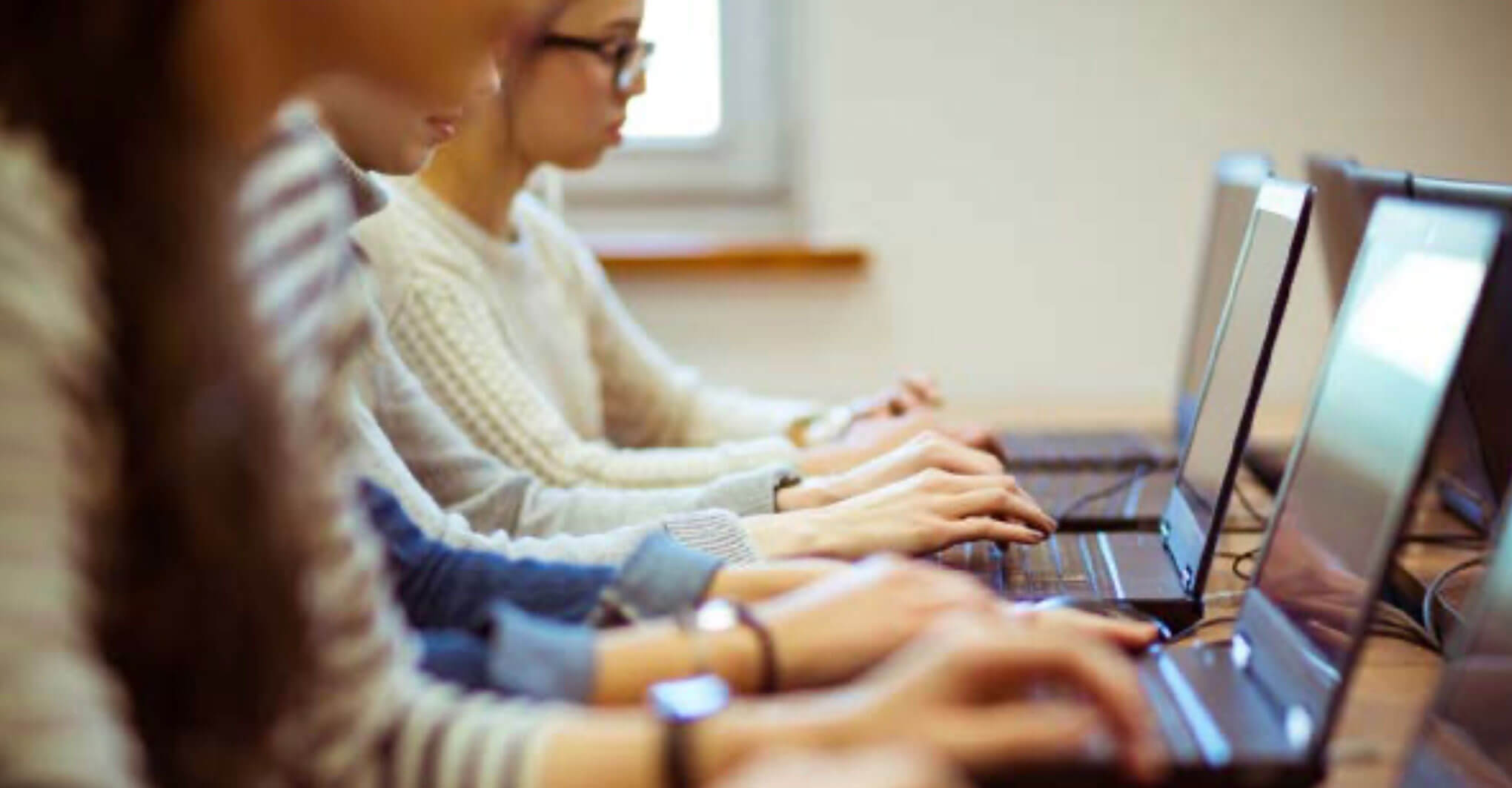 Students using laptop.