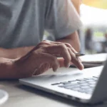 A student at a laptop